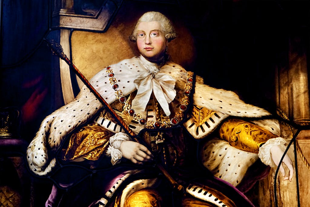 Detailed painting of King George III in ornate regalia, showcasing historical art.