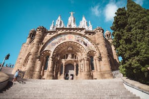 Stunning front view of Temple Expiatori del Sagrat Cor, Barcelona, under a clear blue sky.